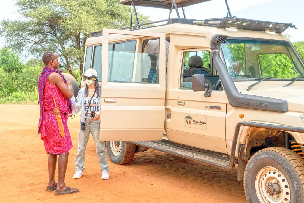 Guest enjoying a Budget Tanzania safari, warmly welcomed by a PAG Safaris guide upon arrival.